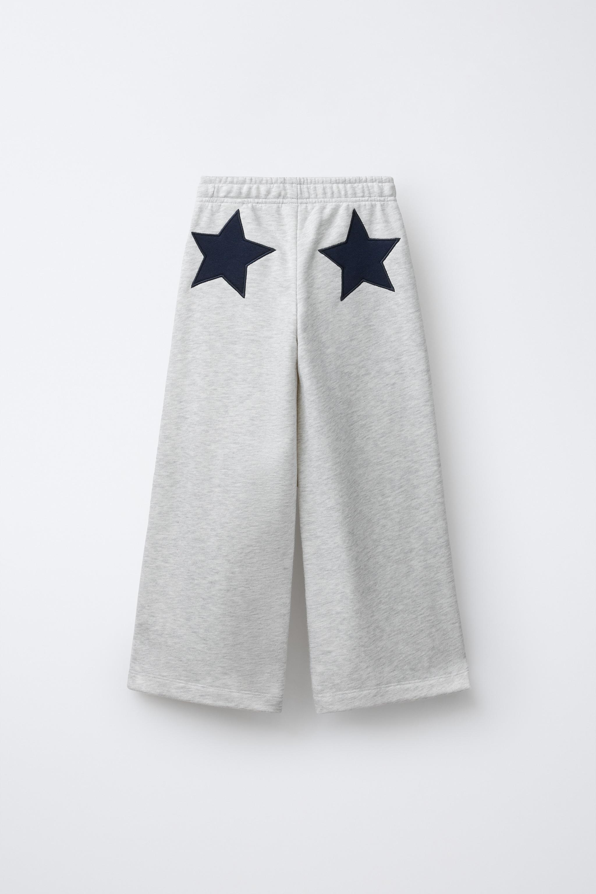 PANTALON EN MOLLETON À JAMBES LARGES ÉTOILES